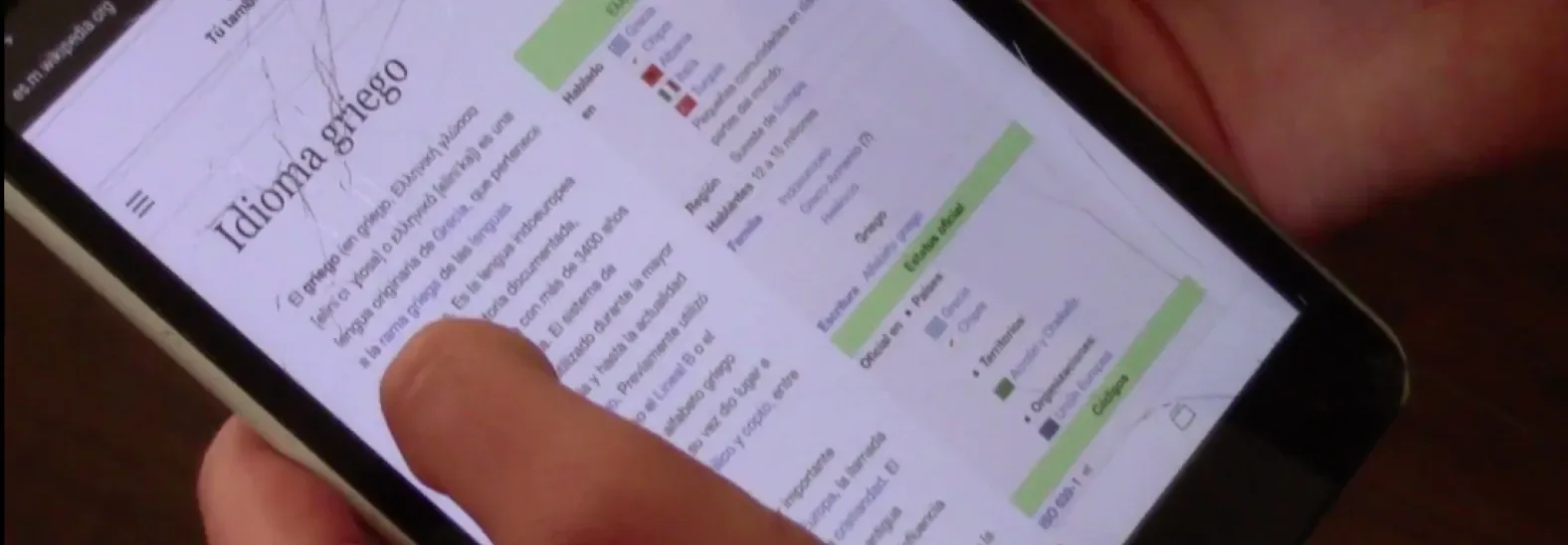 Person reading a Wikipedia article on a tablet device